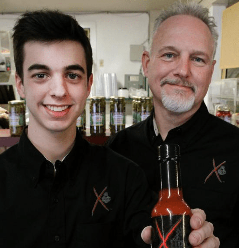 Elijah and Bret Morey with Elijah's Xtreme hot sauce 